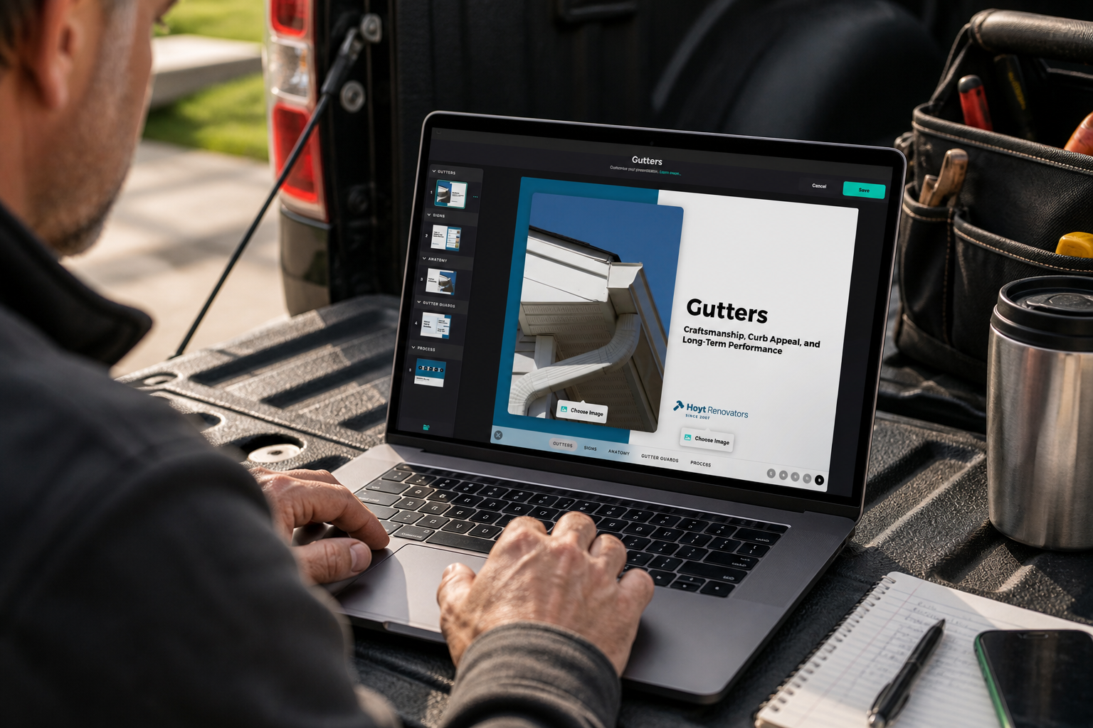 A contractor finishing a Gutters presentation on his laptop in his truck bed